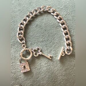 Elegant Silver Charm Bracelet with Key and Lock